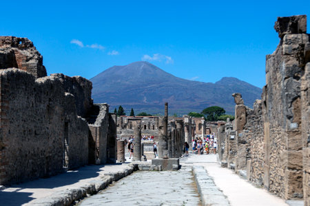 A street in Pompeii with a volcano in the background, the classical Roman cityのeditorial素材