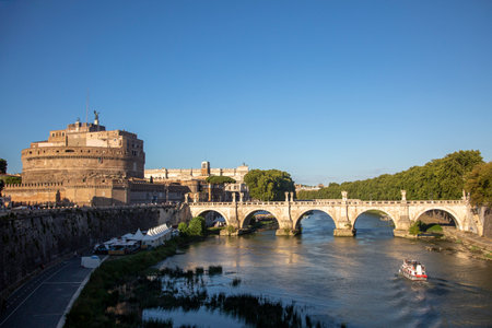 Angel's Castle and Tiber River Bridge, a ship on the river in Rome, Italy