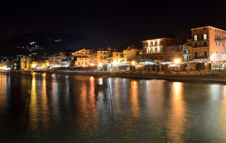 View of the alassio promenade from the pier at nightの写真素材