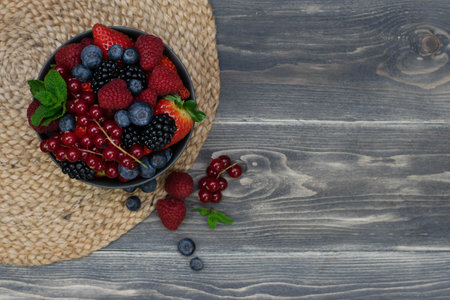 Ripe sweet different berries in bowl. Close up, top view, high resolution product. Harvest Conceptの写真素材