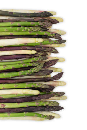 Asparagus group of green healthy vegetables organized in a row isolated on a white background as a food concept of health diet and living a natural fit well nourished life. Top view.の写真素材