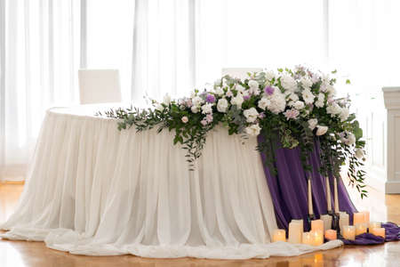 Main table at a wedding reception with beautiful flowers. Wedding day. Wedding decoations with pink flowers.の写真素材