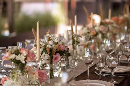 A very nicely decorated wedding table appointments with beautiful decor with plates and serviettes...