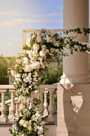 Wedding arch with white flowers arrangements.Wedding decor.の写真素材