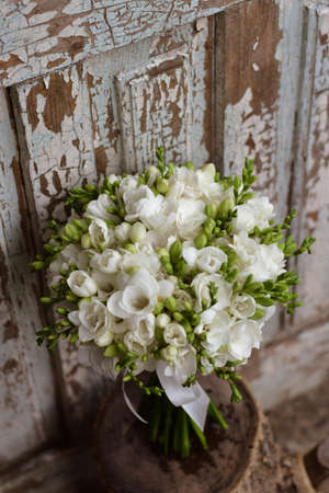 White freesia bridal bouquet on dark background. close up. Wedding bouquet.の写真素材