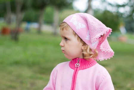portrait of a beautiful little girl walking in the parkの写真素材