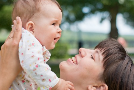 portrait of happy mother and little daughter in the parkの写真素材