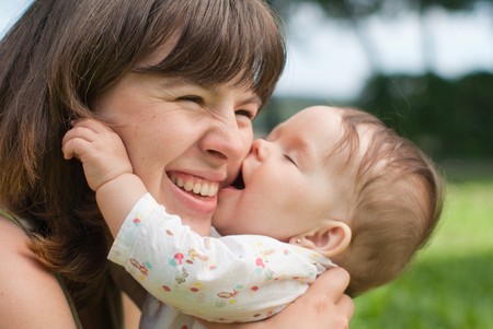 portrait of happy mother and little daughter in the parkの写真素材