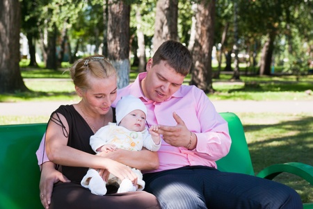 portrait of a happy family in a summer parkの写真素材