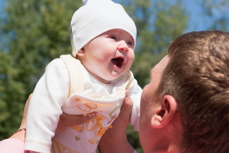 Dad looks at his joyful kid