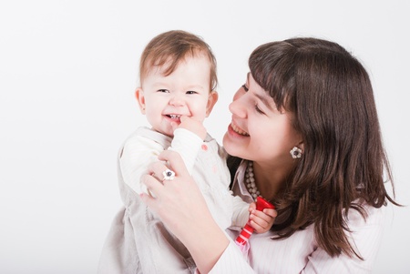 Portrait happy mums with a daughter on a white background
