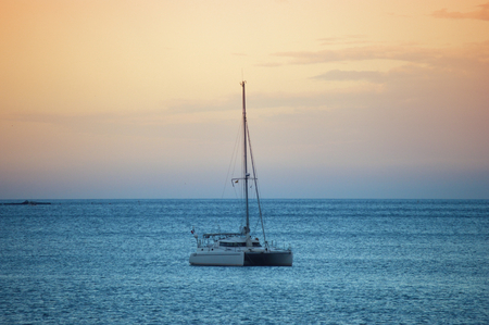 Ship sailing in the Mediterranean at sunsetの写真素材