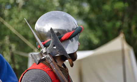medieval soldier with helmet and axの写真素材