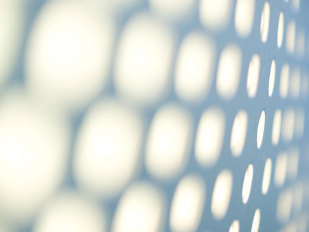 Metal plate with holes blurred