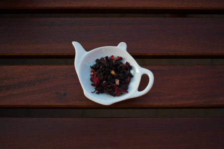 Herbal tea blend in teapot with wooden backgroundの写真素材