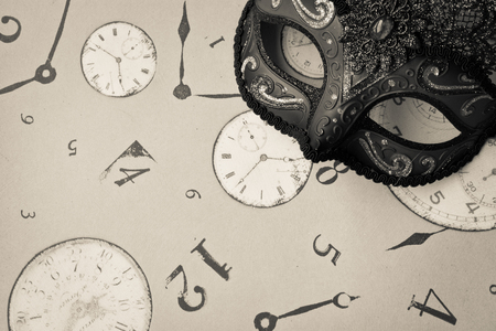Enigmatic carnival mask in black and white backgroundの写真素材