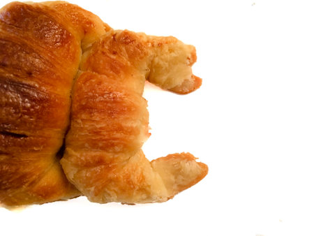 Fresh Argentine croissants, medialunas de Manteca in white background with copy spaceの写真素材