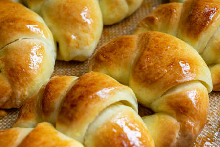 Argentine croissants, medialunas de Manteca over silicon pastry mat close-upの写真素材