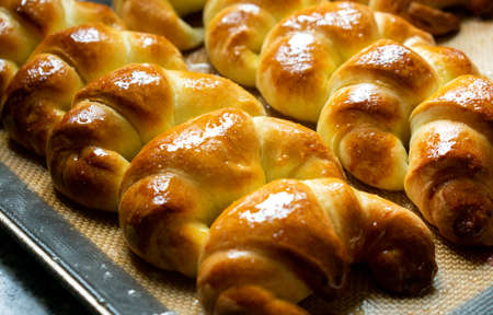 Argentine croissants, medialunas de Manteca over silicon pastry mat backgroundの写真素材