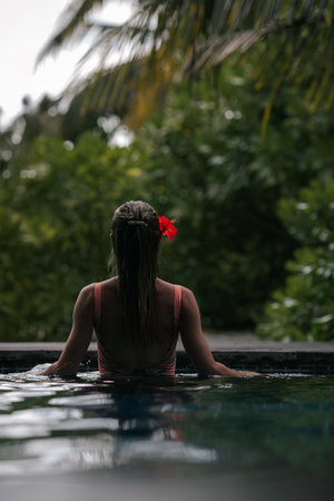 Blonde girl on the tropical Maldives Summer beach resort