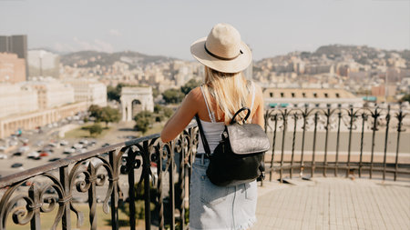Young smiling girl tourist exploring new city at summer