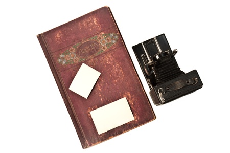 old album with historic bellows camera