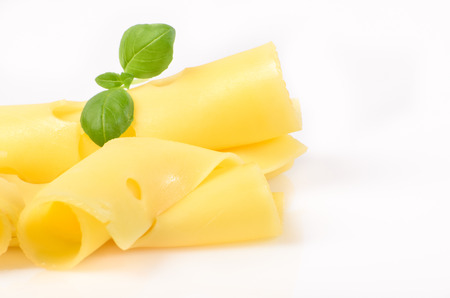 Slices of cheese on white background, tomato, Basil