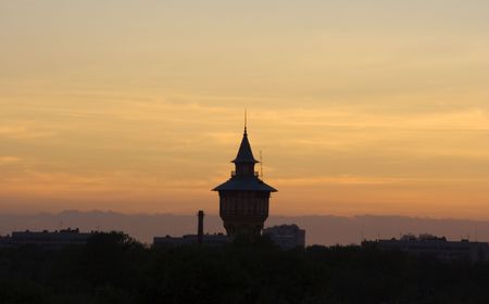 Fantasy magic tower on a background of a sunsetの写真素材