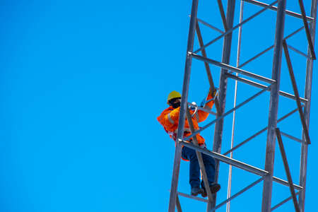 Fitter climbing a tower