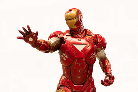 Valladolid, Spain - march 8, 2020 : Spider-Man model sit down is isolated on white background of character from Spiderman movie franchise. Spider-Man is a fictional superhero in Marvel Comics.のeditorial素材