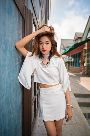 Outdoor beauty women fashion portrait of model posing with vintage colours tone conceptの写真素材