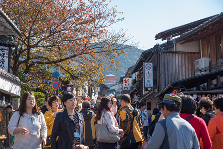 Kyoto, Japan - November 6, 2015: Tourists walk on a street around Kiyomizu Temple. Kiyomizu is a famous temple in Kyoto built in year 778. The temple is part of the Historic Monuments of Ancient Kyotoのeditorial素材