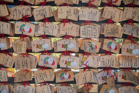 Kyoto, Japan - November 6, 2015: Dragon wooden prayer tablets at Kiyomizu dera - Kyoto. Pray for happieness, healthy, luck by write a word on wooden tablet.のeditorial素材