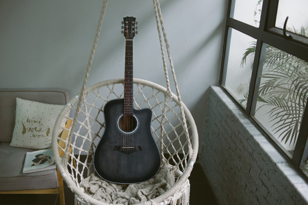 guitar on retro swing chair