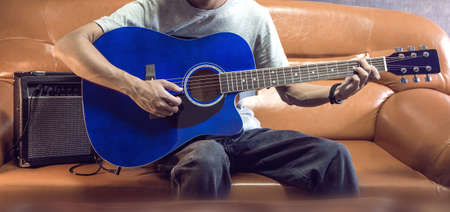 Playing a 41-inch folk acoustic acoustic guitar