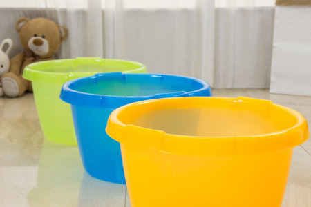 Colored plastic washbasin and laundry basinの写真素材