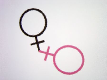 close up sight of two female symbols illustration treated with an effect of glassの写真素材