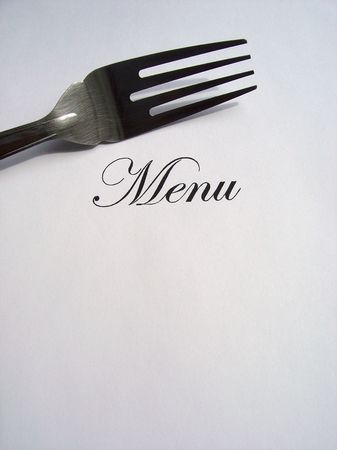 Close up view of the word Menu written and a fork all on a white background with free space to write what you wantの写真素材