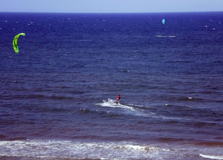 diurnal view of a Sportsman practising kitesurfing in the seaの写真素材