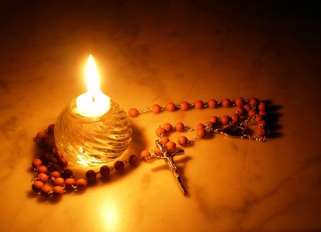 Rosary and candle    の写真素材