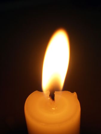 candle macro view on a dark background      の写真素材