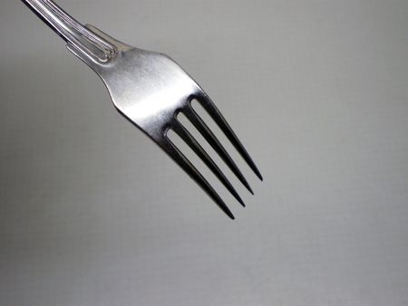 Fork on a grey shadow background      の写真素材