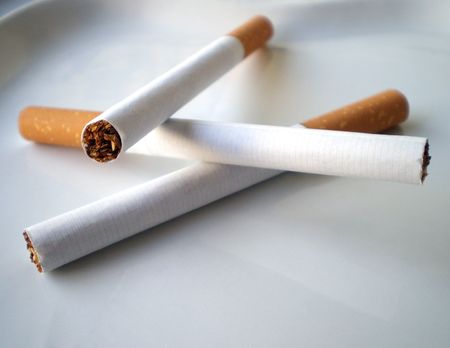 Cigarettes on a white ashtray