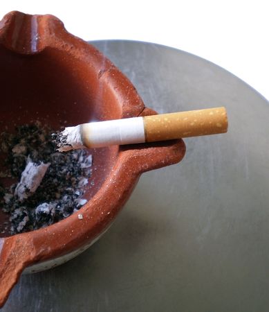 Ashtray with a cigarette       の写真素材