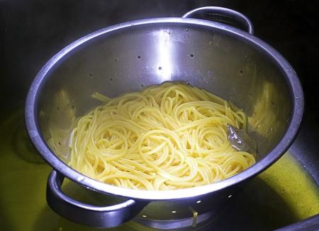 spaghetti in a drainer