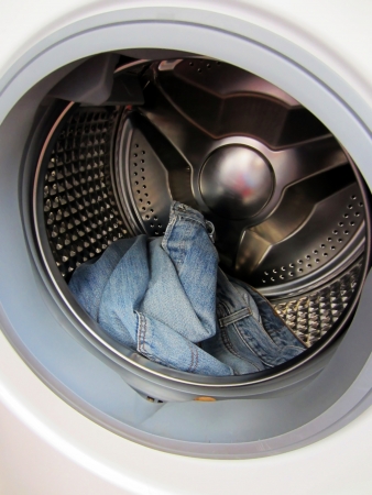 jeans in a washing machineの写真素材