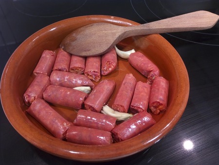 Cooking chistorra (pork sausage) typical spanish tapaの写真素材