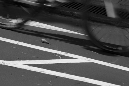 Blurry cyclist silhouette and shadowの写真素材