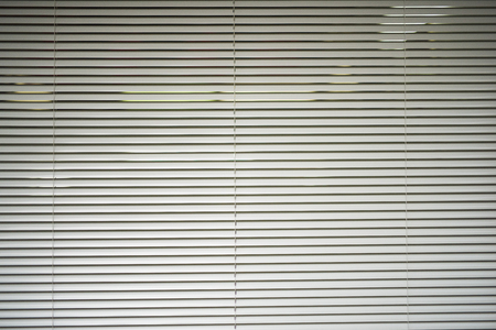 White horizontal metal roller blindsの写真素材