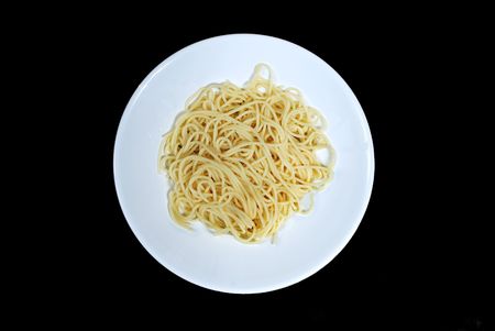 plate with spaghetti macaroni isolated on blackの写真素材